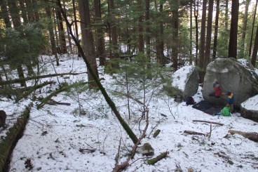 Liam bouldering in a snowy Squamish Forest